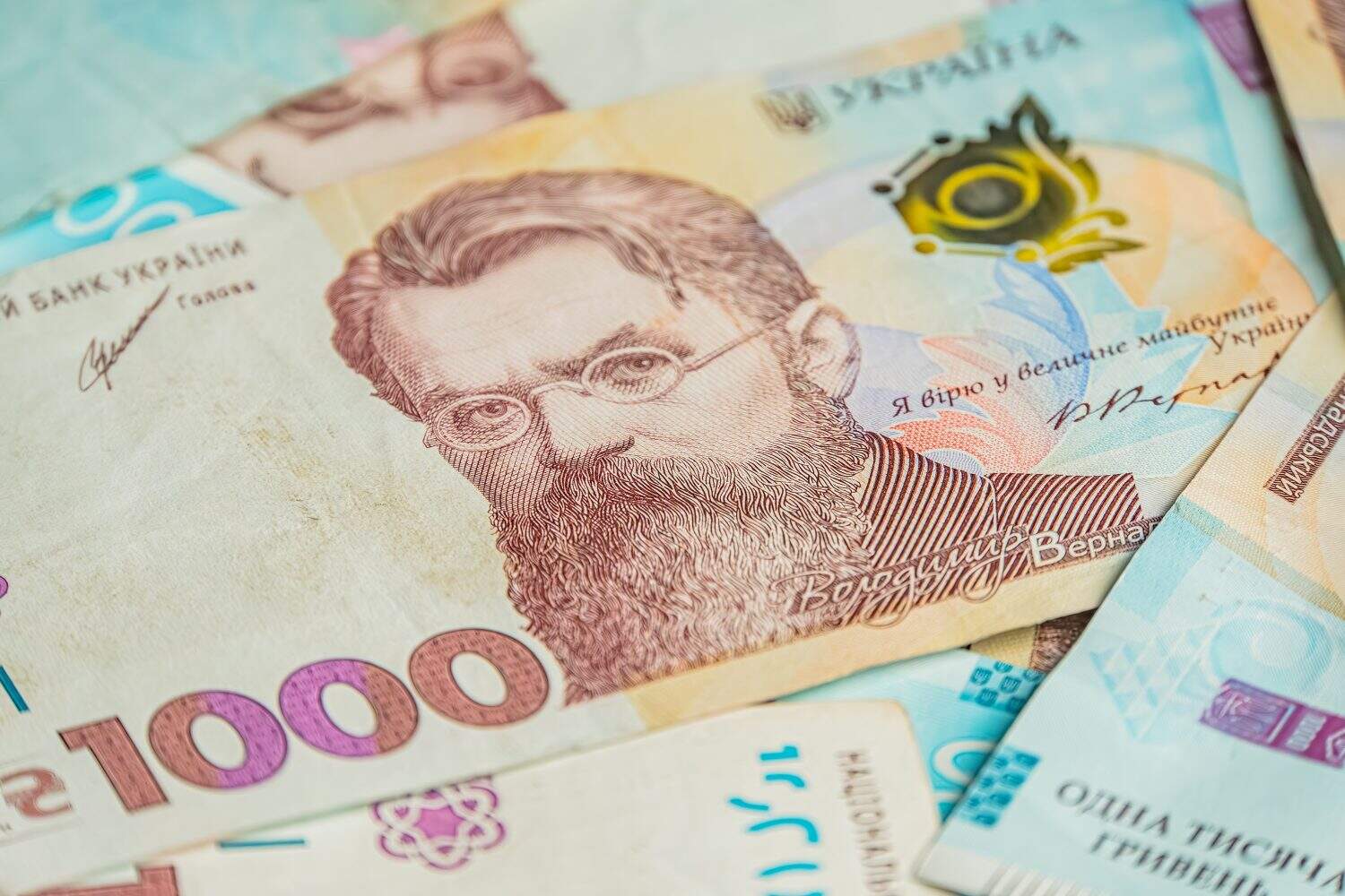 Ukraine money 1000 hryvnia background. Ukrainian finance, salary, pension, donations, taxes. Background of the 1000 hryvnia a