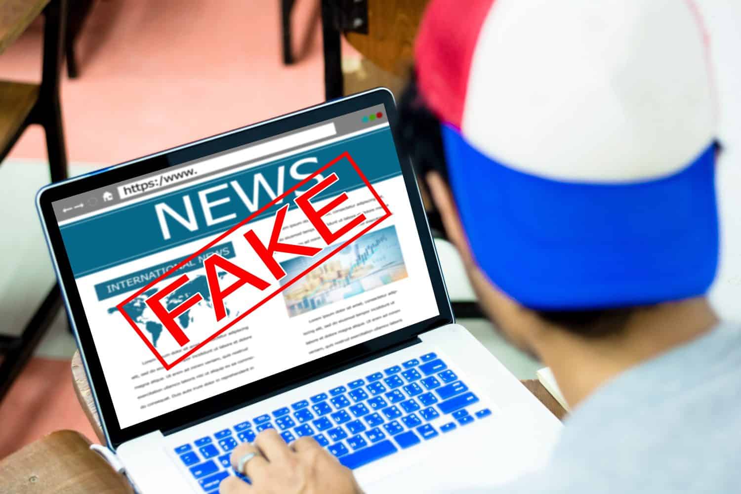 Fake news, HOAX concept.Young man using laptop or computers