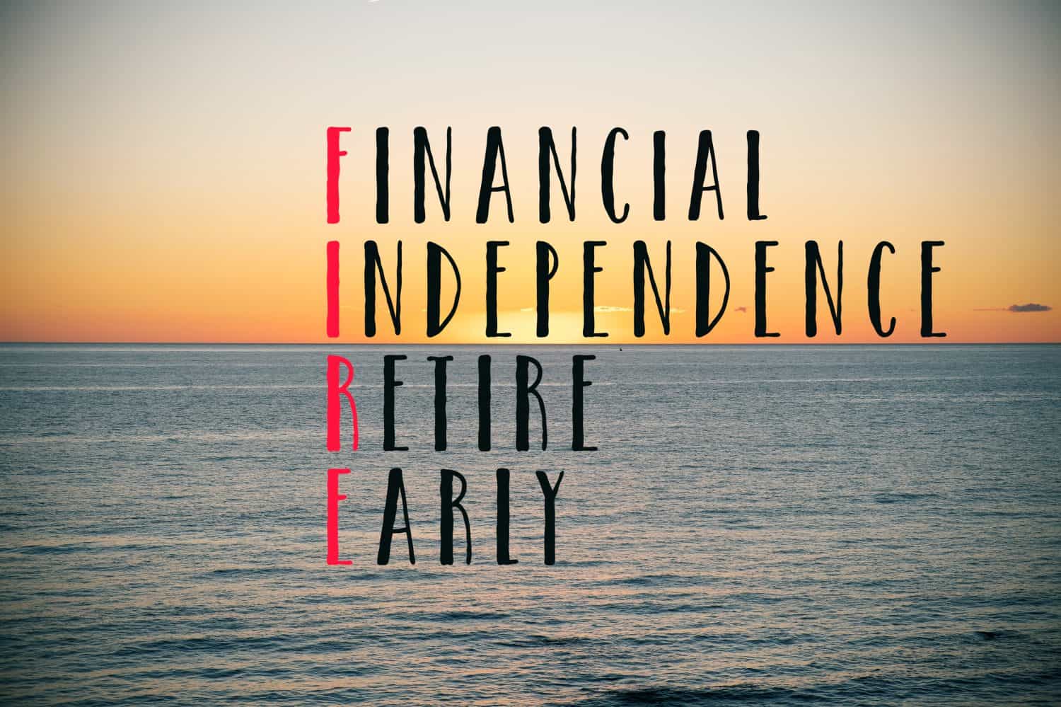 the word fire, acronym for financial independence retire early, on the sky and the ocean at dawn or at sunset