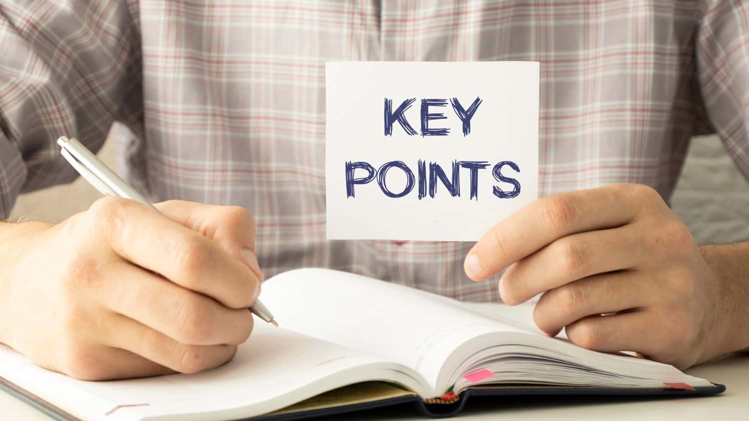 Closeup on businessman holding a card with text KEY POINTS, business concept image with soft focus background and vintage tone