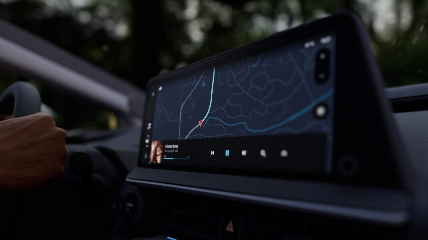 A car's dashboard display shows a GPS map and music interface. The sleek design highlights modern driving apps for navigation and entertainment