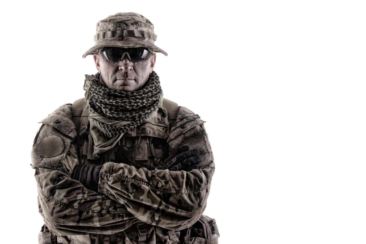 Shoulder portrait of skilled commando fighter, army forces veteran, professional military mercenary, experienced soldier in camo bonnie, glasses and shemagh studio shoot isolated on white background