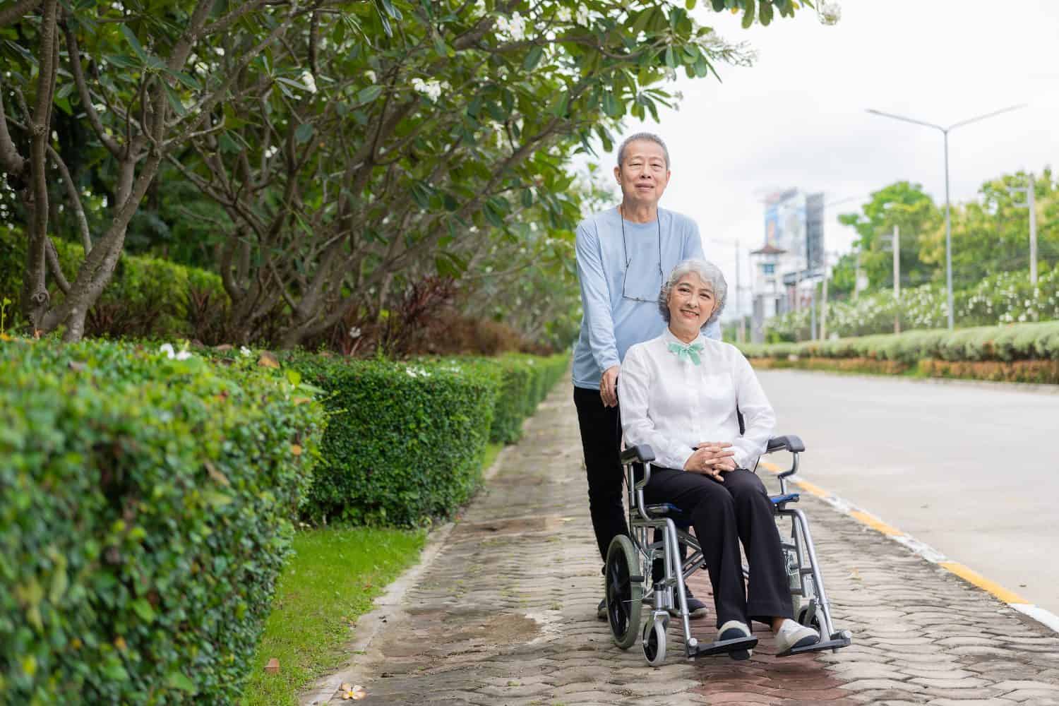 Senior Asian couple playing and teasing each other Happy family concept together outside the house Enjoy a fun lifestyle during retirement. Family health care