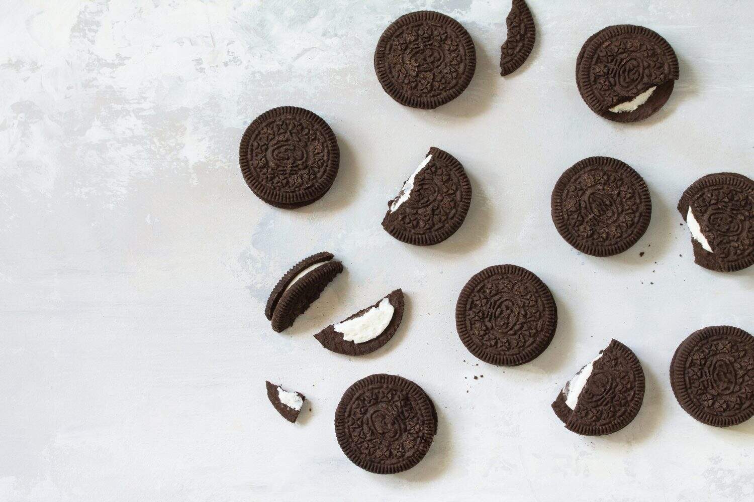 Christmas cookies and chocolate flavor cream isolated on a light gray stone background. Top view flat lay background.