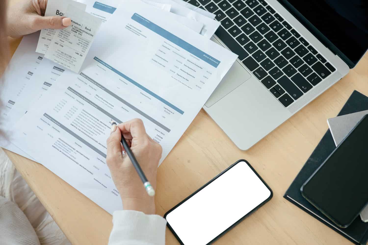 Woman checking credit card billing information