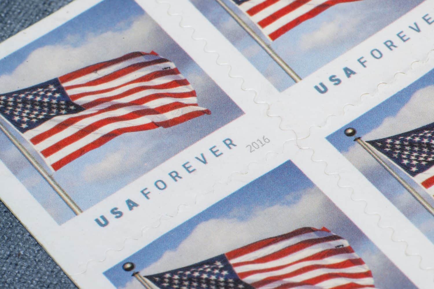 Close up of four U.S.P.S. forever stamps series 2016, overhead angled view