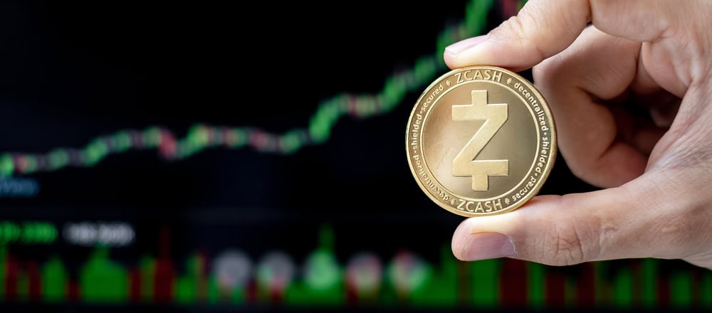Golden Zcash (ZEC) cryptocurrency coin with candle graph background, Crypto is Digital Money within the blockchain network, is using technology and online internet exchange.