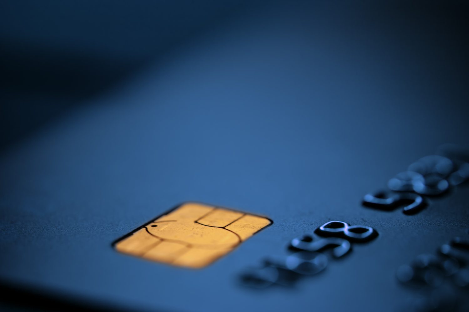 Blue bank credit debit card,blurred copy space,suitable for adding text, macro closeup shot,Coronavirus COVID-19 global pandemic crisis,cryptocurrency alternative EMV method of money transfer concept