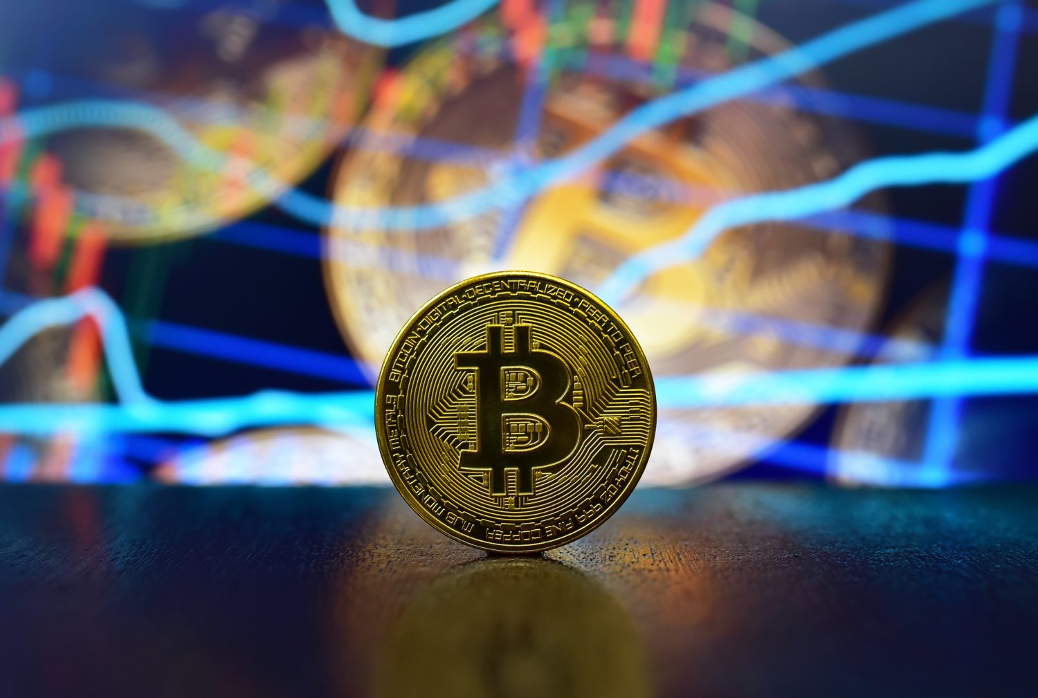 Bitcoin coin on background of cryptocurrency trading exchange chart. BTC mining and investing concept. Blockchain and financial technology. Crypto prices and charts, listed by market capitalization