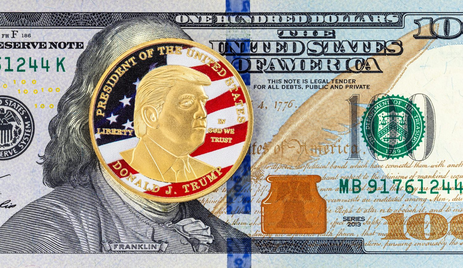 Coin with a portrait of Donald Trump on a 100 dollar bill of the United States of America. Let's Make America Great Again.