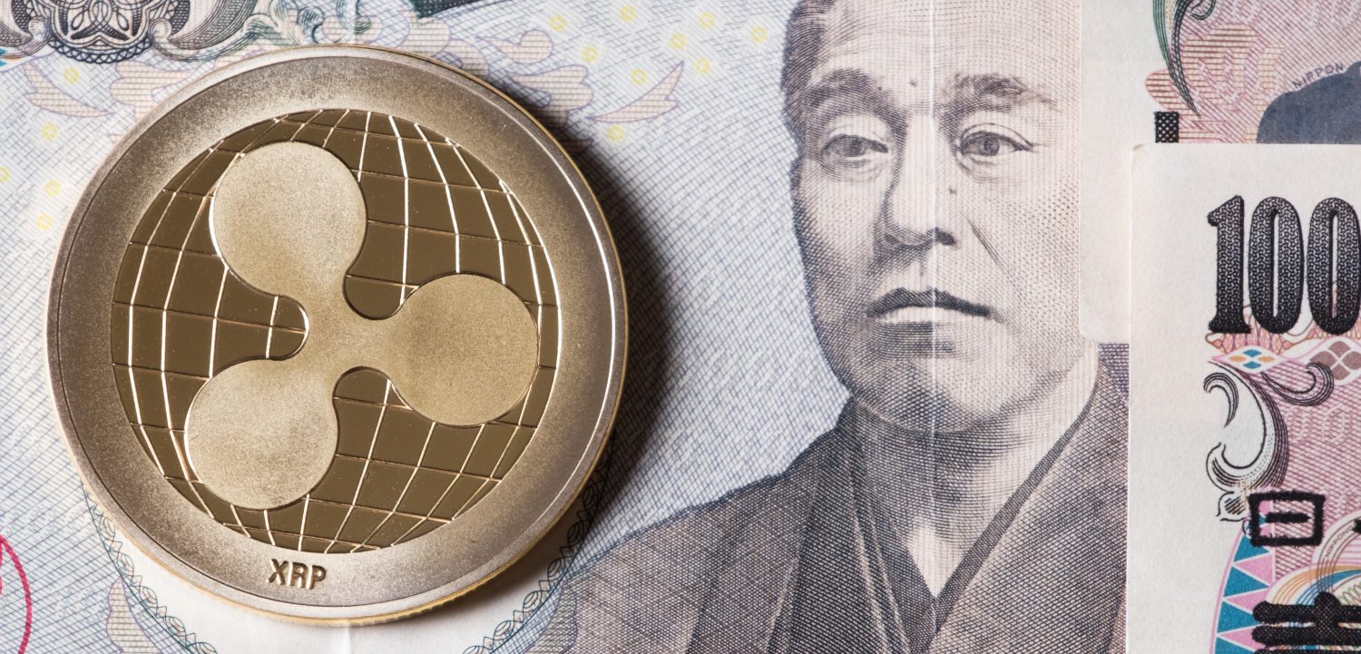 Ripple coin crypto currency on Japanese yen bank notes