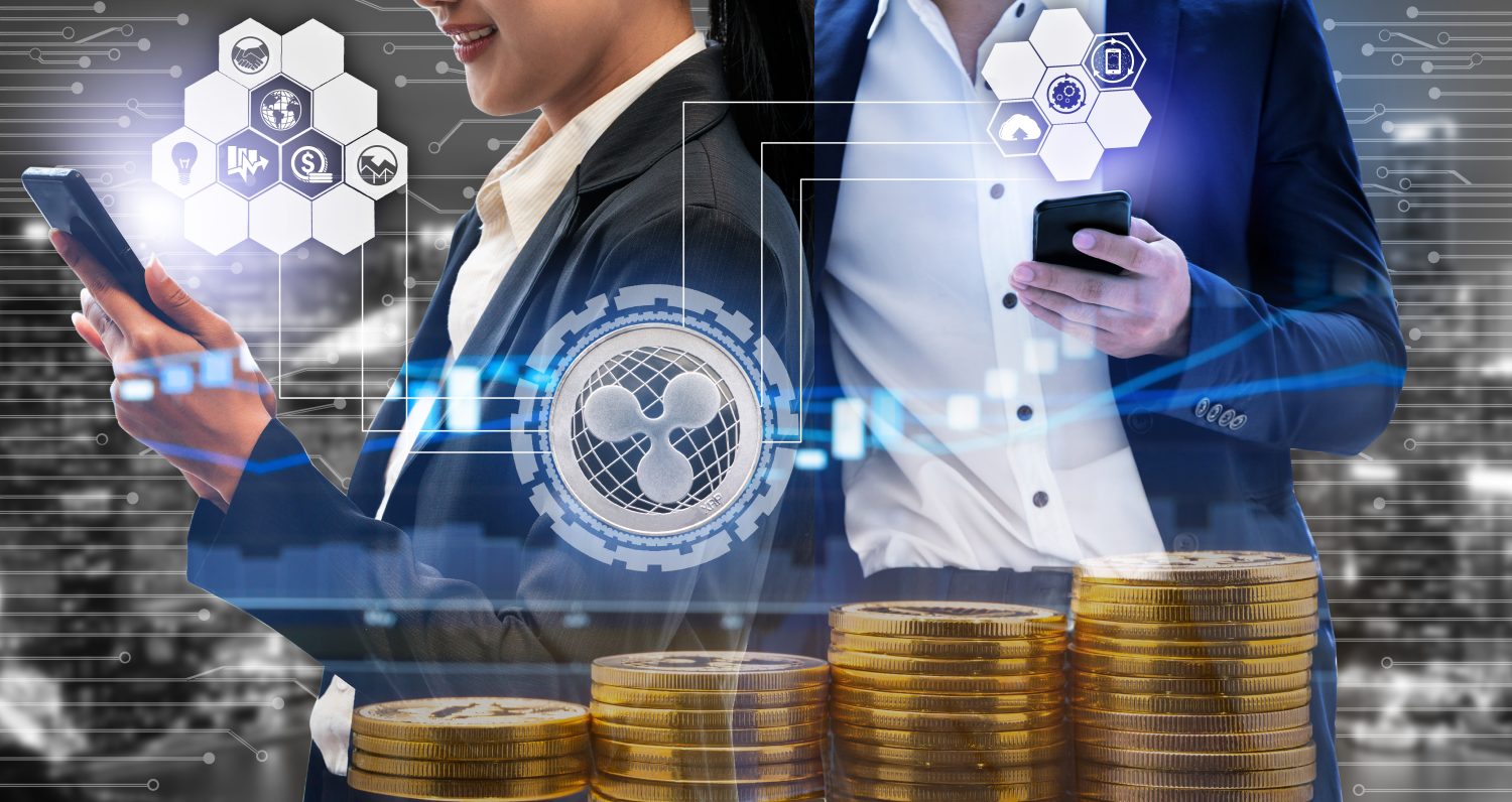 Ripple and cryptocurrency investing concept - Businessman using mobile phone application to trade Ripple XRP with another trader in modern graphic interface. Blockchain and financial technology.