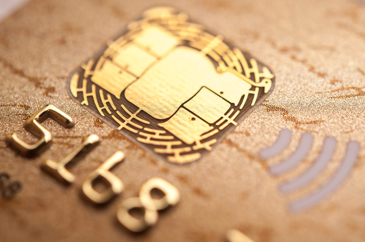 Stack of bank cards. Credit cards. Close-up picture of a credit cards as a background. Macro shot , Selective focus. A microchip and raised numbers on a bank card