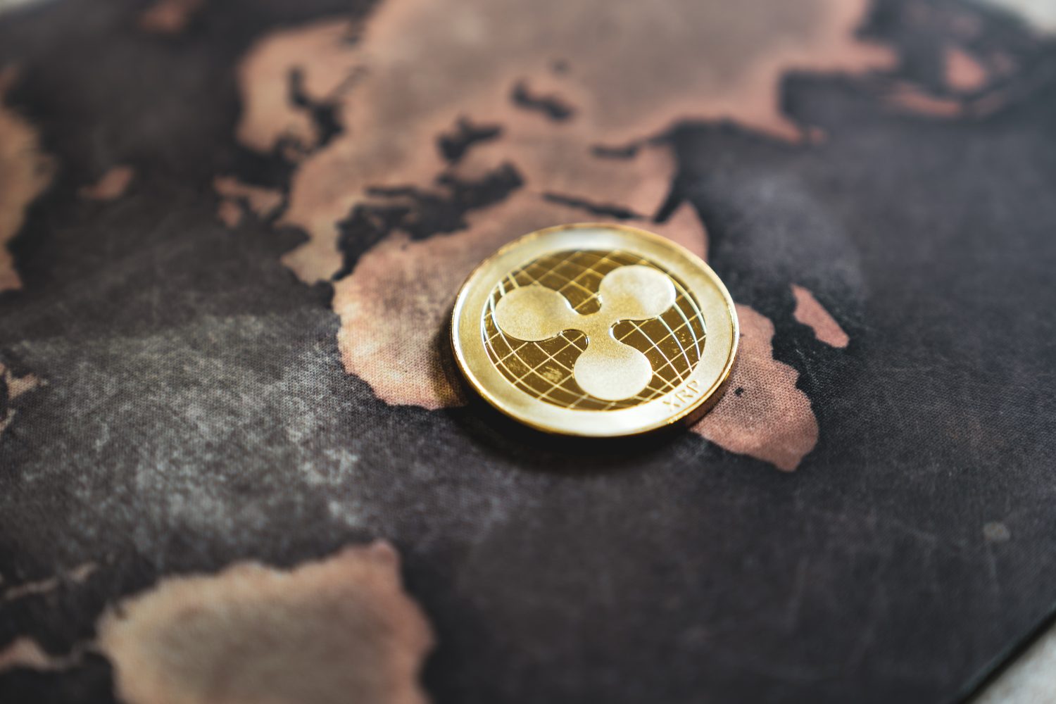 Gold Ripple XRP Coin Token on World Map in Africa