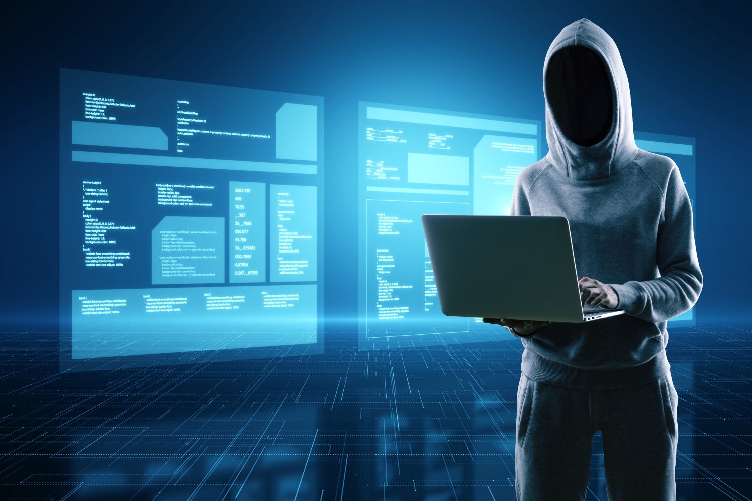 Hacker in hoodie using laptop computer with digital database folded on blurry blue background with reflections. Digital transformation, hacking, data theft and media concept