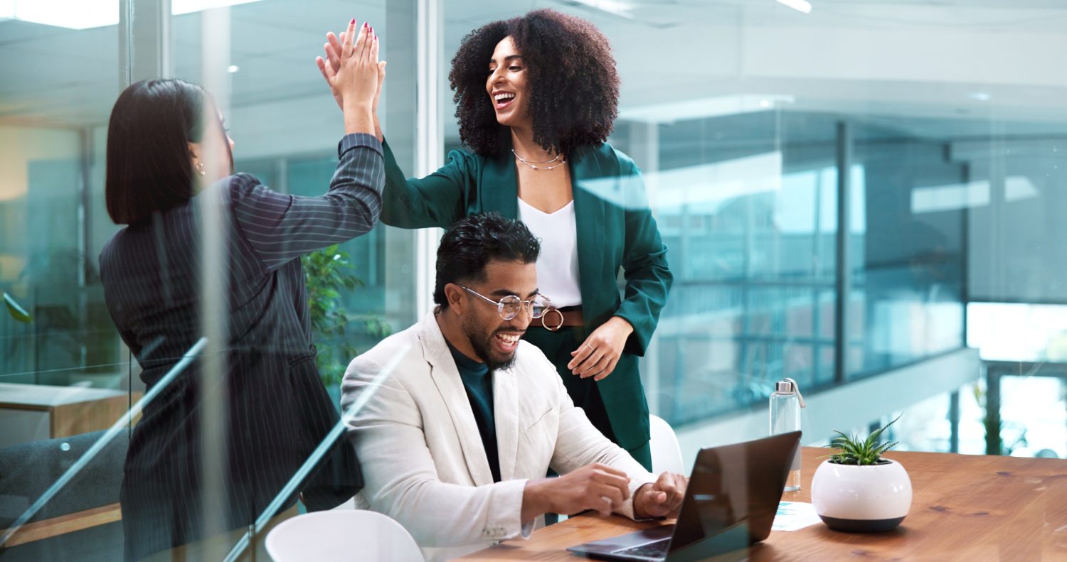 Team, business people and high five in office for celebration, winning or financial trading. Happy workers, hands together and success for stock market target, goal achievement and laugh with laptop