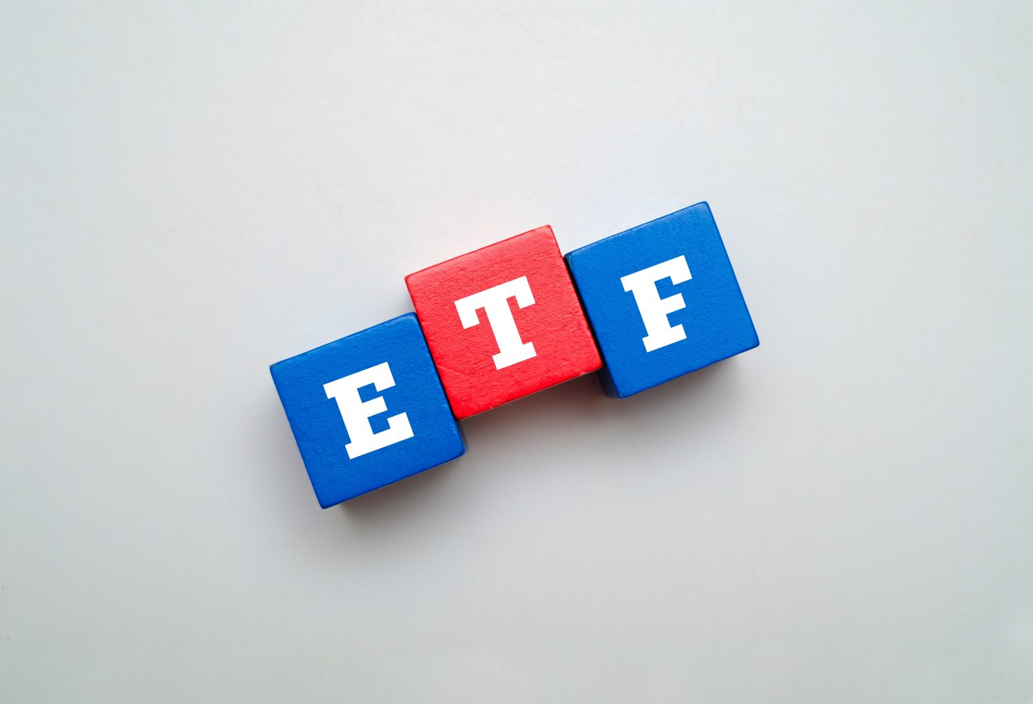Colorful block with text ETF. ETF acronym for EXCHANGE TRADED FUND